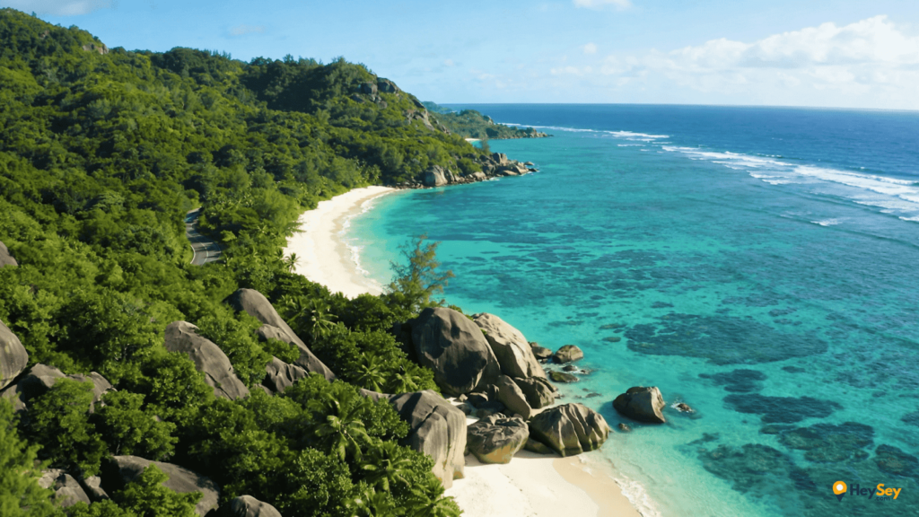 Praslin Island Seychelles coastline with tropical forest beaches and clear blue water